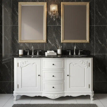 Bathroom vanity with white cabinets, black marble countertop, and gold-framed mirrors against a dark marble wall.