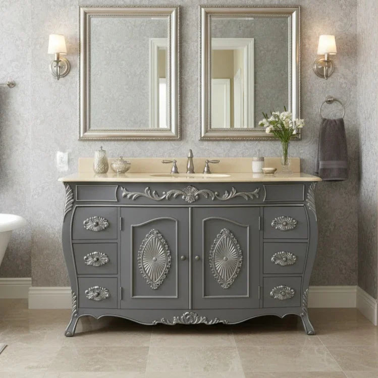Gray bathroom vanity with decorative details, two mirrors, and wall lights.