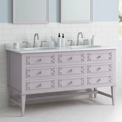 Bathroom vanity with double sink and light gray cabinets.