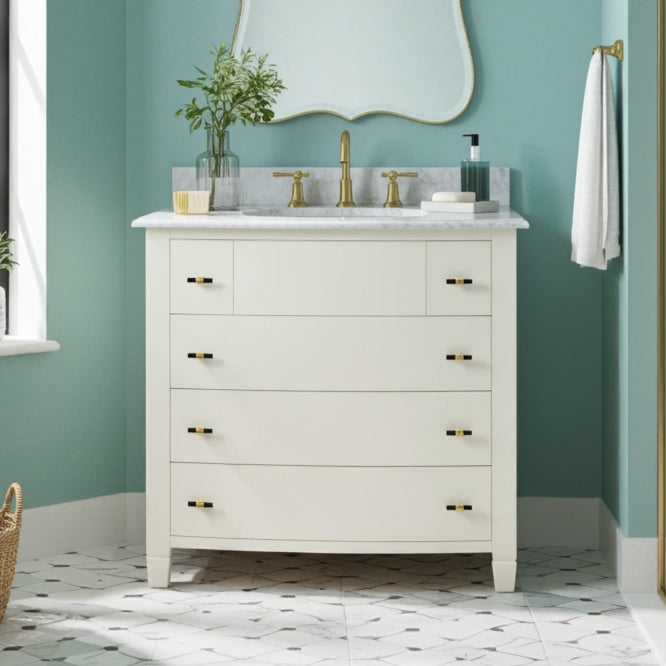 Bathroom vanity with marble countertop, gold fixtures, and teal walls.