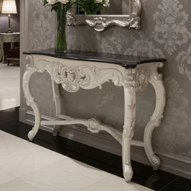 Decorative console table with marble top in an elegant room setting.