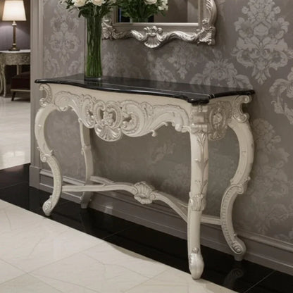 Decorative console table with marble top in an elegant room setting.