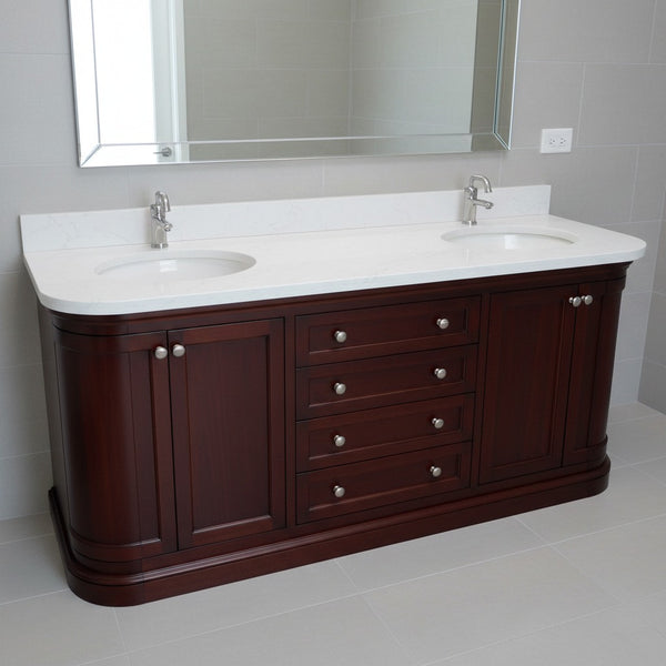 Bathroom vanity with two sinks and a large mirror above it.